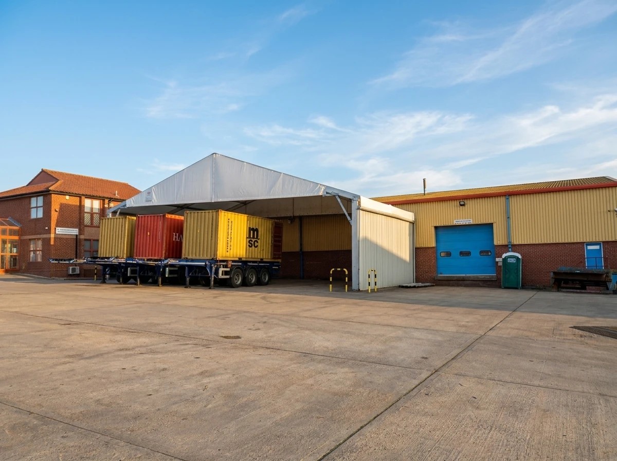 The yard at our UK depot, container trailers lined up beside the loading bay